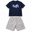 Conjunto AMIRI azul marino y gris claro