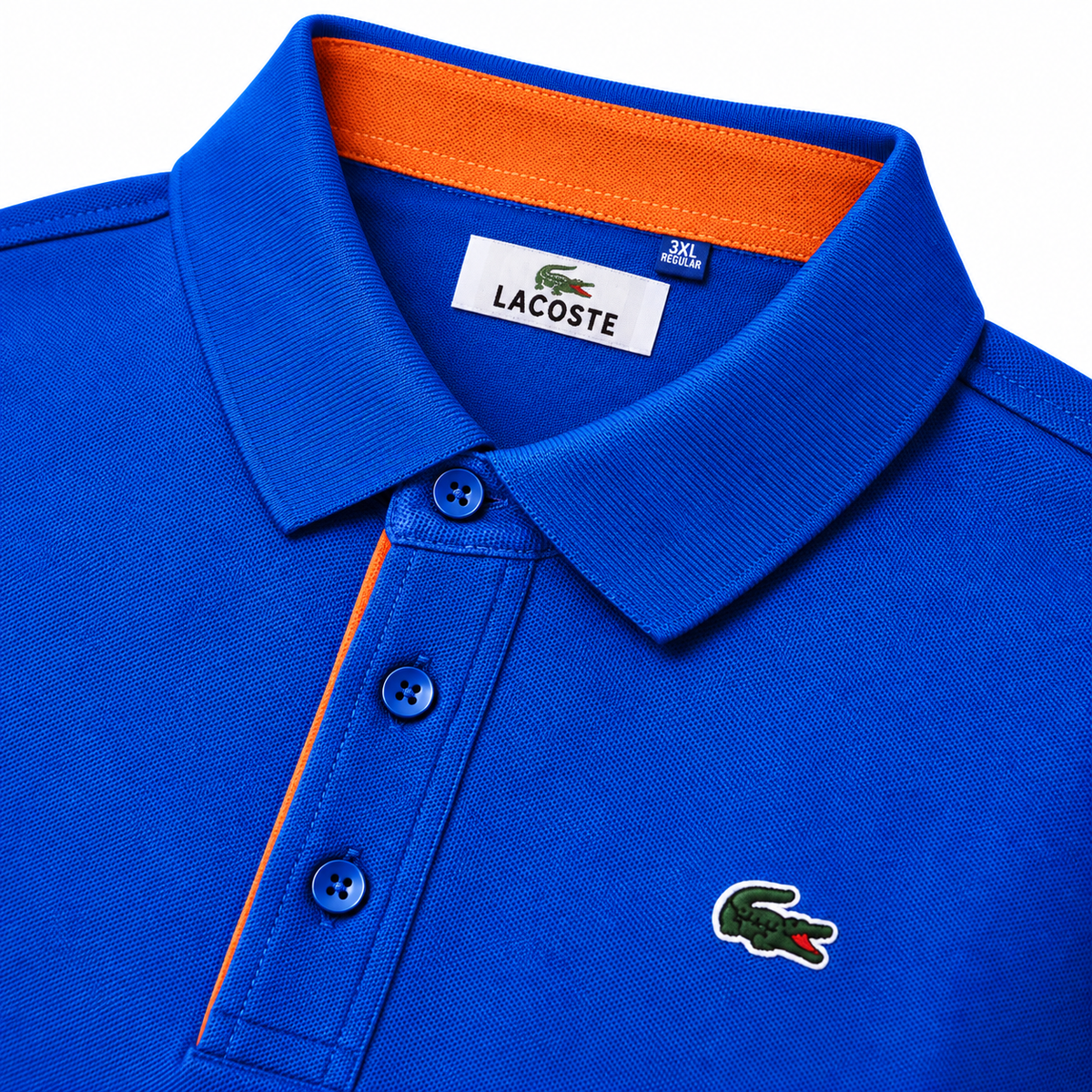 Polo Lacoste azul con detalles naranjas