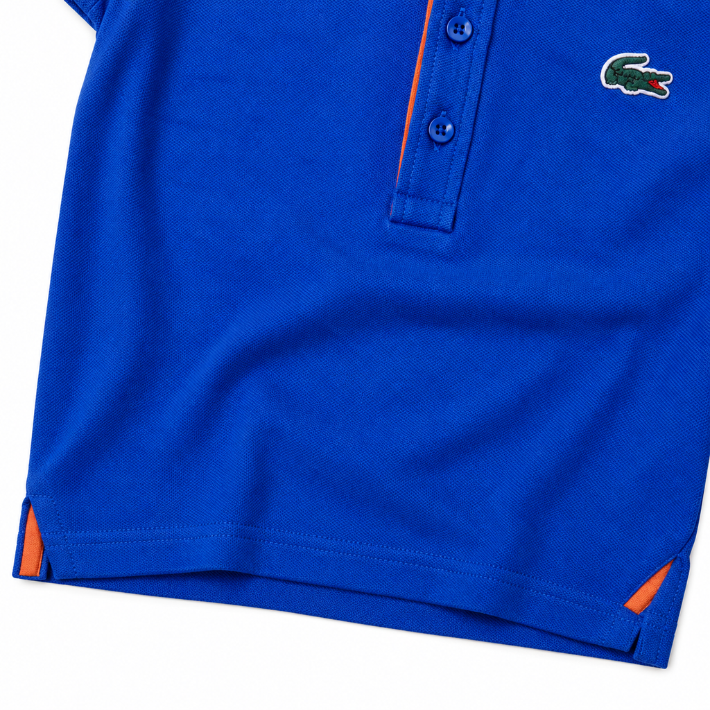 Polo Lacoste azul con detalles naranjas